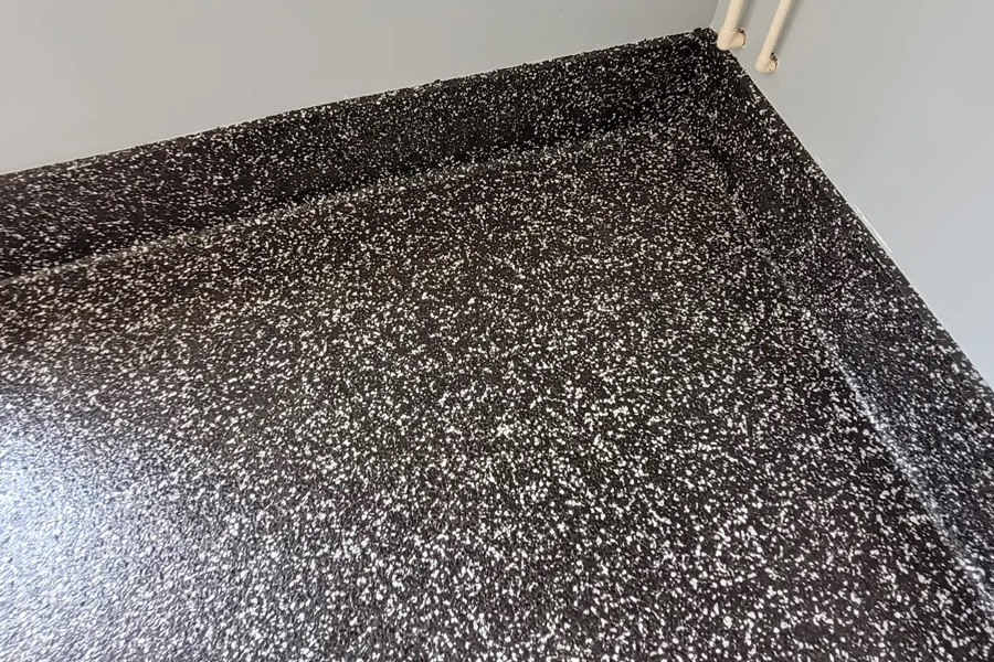 Professional flake quartz floors with decorative chips and slip-resistant finish